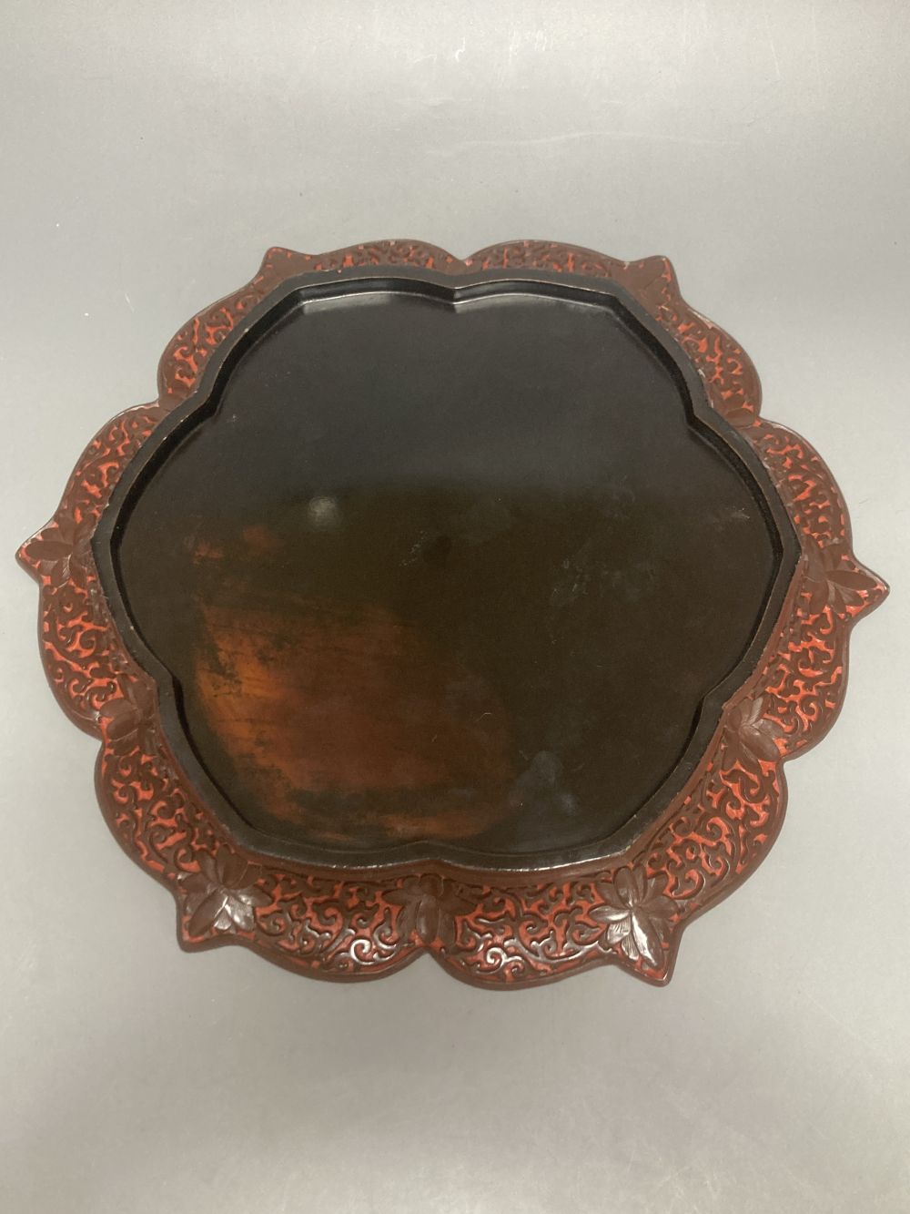 A Chinese carved cinnabar lacquer dish, early 20th century, 33.5cm